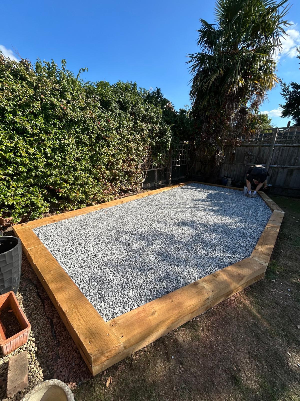 Gravel area framed with timber edging in a garden